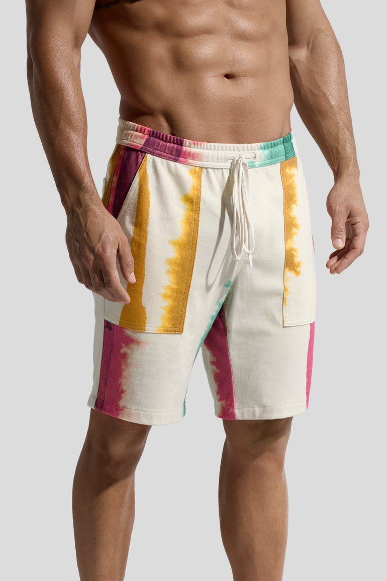 Picture of organic cotton shorts named Deia with Eivissa Print on male model side view by Bas Bains