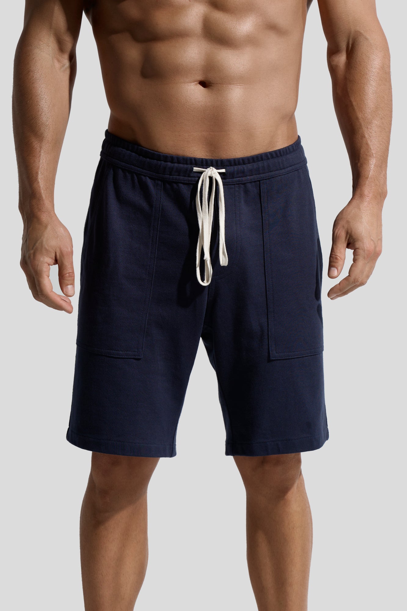 image of navy organic cotton shorts front on model by bas bains