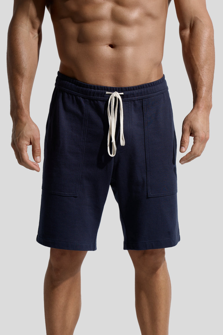 image of navy organic cotton shorts front on model by bas bains