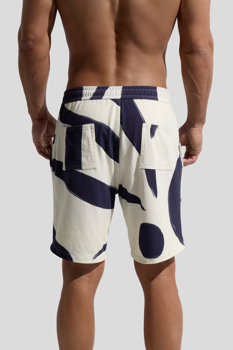 image of organic cotton shorts in Rivage print back view on male model by bas bains