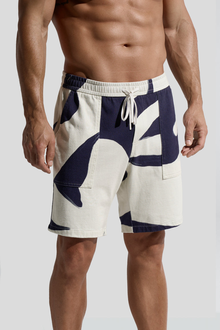 image of organic cotton shorts in Rivage print side view on male model by bas bains