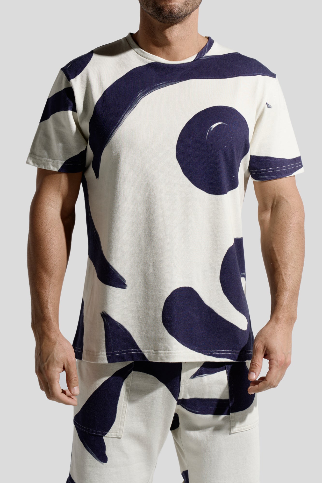 image of organic cotton T-shirt in Rivage print front view on male model by Bas Bains