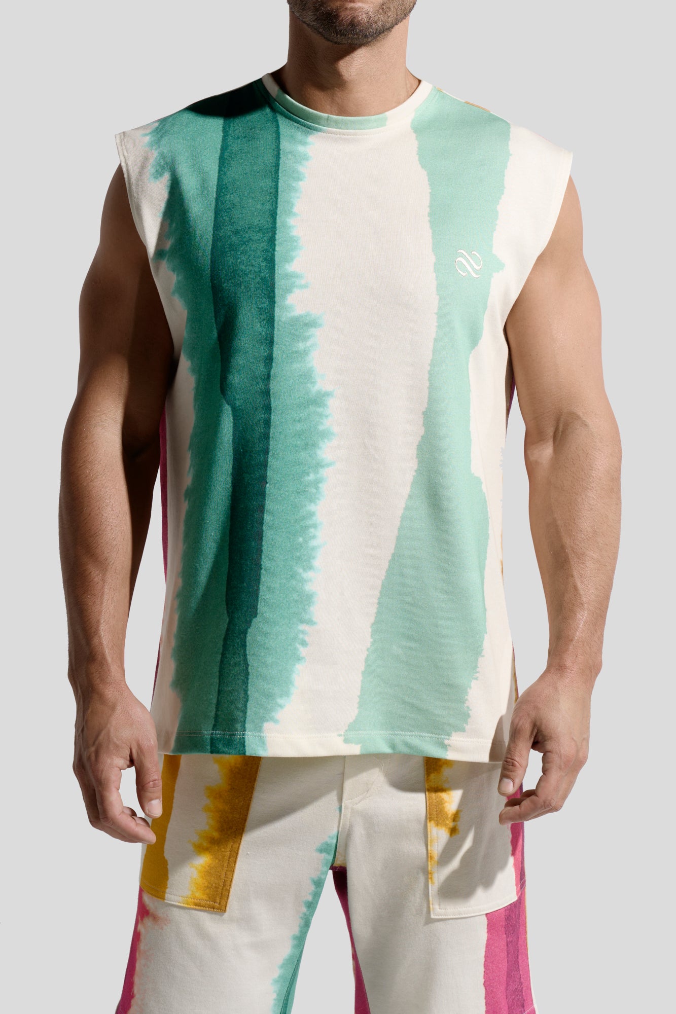 image of organic cotton tank top in Eivissa print front view on male model by Bas Bains